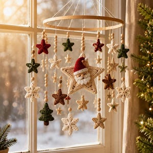 May include: A hanging mobile featuring a circular wooden frame with dangling crocheted ornaments including stars, small Christmas trees, and a central star with a Santa Claus face. The ornaments are in cream, red, green, and brown, accented with wooden beads.