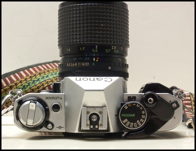 Canon AE-1 Program Camera with Wide to Short Telephoto Lens Vintage Working 1980s 35MM Film SLR with Hippy Neck Strap and Free Shipping