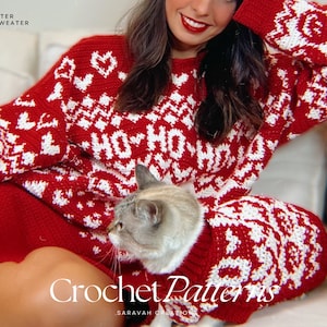 May include: A red and white crocheted sweater with a "Ho Ho Ho" pattern. A cat is wearing a matching red and white crocheted sweater.