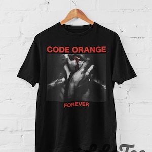 Camiseta unisex de algodón grueso con banda naranja de edición limitada