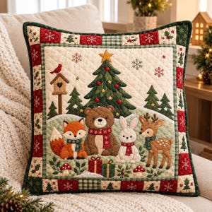 May include: A square quilted throw pillow featuring a festive winter scene with a central Christmas tree, a brown bear, a fox, a white rabbit, and a deer. The border is decorated with red and green squares, snowflakes, and holly patterns.
