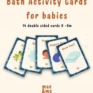 May include: A set of 14 double-sided bath activity cards for babies aged 0-6 months. The cards feature a blue water-patterned border and illustrations including a frog, a splash, a child, soap, and a towel with text labels like Warm Towel.