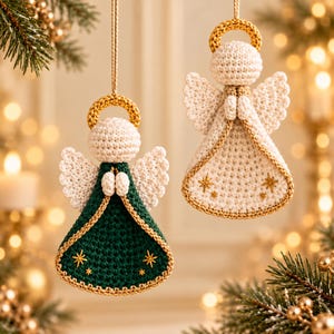 May include: Two hanging crochet angel ornaments. One angel features a dark green dress with gold trim and star embroidery, while the other has a cream-colored dress with gold trim and star embroidery. Both have gold halos and white wings.