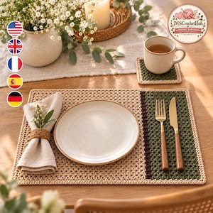 May include: A rectangular crochet placemat featuring a beige base with a dark green and brown side panel. It includes a beige ceramic plate, a linen napkin with a brown crochet ring, a gold fork, and a gold knife with wooden handles.