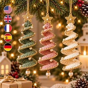 May include: Three spiral-shaped Christmas tree ornaments made of crocheted yarn in sage green, dusty pink, and cream. Each ornament features a gold-colored star at the top, small white pearl beads along the spiral edges, and a larger pearl at the base.