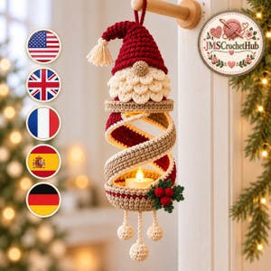 May include: A hanging crochet gnome ornament featuring a red pointed hat with a cream tassel, a textured cream beard, and a spiral body in red and beige. It holds a small LED tea light and is decorated with green leaves and red berries.