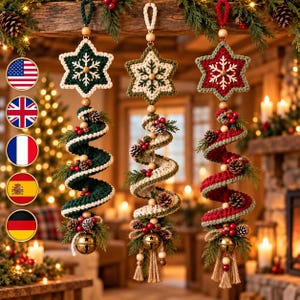 May include: Three hanging crochet ornaments featuring star-shaped tops with snowflake patterns. Each ornament has a spiral body decorated with pinecones, red berries, and greenery, finished with a gold-toned metal bell and tassels.