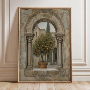 May include: A framed wall art print depicting a stone archway with two columns framing a courtyard scene. In the center, a potted orange tree with green leaves and bright orange fruit stands on a stone floor, with a tall cypress tree in the background.