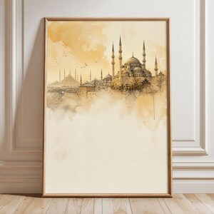 May include: A vertical framed wall art print featuring a sepia-toned watercolor illustration of a city skyline with a prominent mosque, multiple domes, and slender minarets. The artwork uses soft golden and brown washes with birds in the sky.