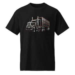 May include: A black short-sleeve t-shirt featuring a graphic print of a semi-truck with a livestock trailer. The truck is rendered in black and white with orange-red outline details, showing a detailed cab, exhaust stacks, and wheels.