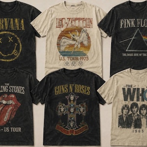Peut inclure: Une collection de six t-shirts à manches courtes arborant des graphismes de groupes au style vintage. Les t-shirts incluent Nirvana, Led Zeppelin, Pink Floyd, The Rolling Stones, Guns N' Roses et The Who, en noir et crème.