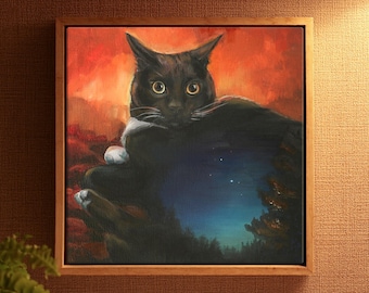 May include: A square framed painting featuring a black cat with wide yellow eyes. The background transitions from a vibrant orange and red sunset sky at the top to a dark blue night landscape with visible stars at the bottom, framed in wood.
