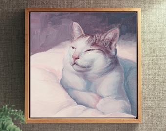 May include: A square framed oil painting depicting a white cat with light brown markings on its head, resting with its eyes partially closed. The cat is positioned on a soft, light-colored surface, rendered in soft brushstrokes with purple and blue tones.