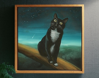 May include: A framed painting of a black and white cat with yellow eyes sitting on a wooden branch against a dark blue night sky with stars. The cat has a white chest and white paws, and the background features a soft, glowing horizon line.
