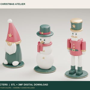 May include: Three 3D digital character models labeled PACKLAB3D CHRISTMAS ATELIER. The set includes a gnome with a pink hat, a snowman with a green hat and scarf, and a nutcracker in a pink uniform, all standing on circular green bases.
