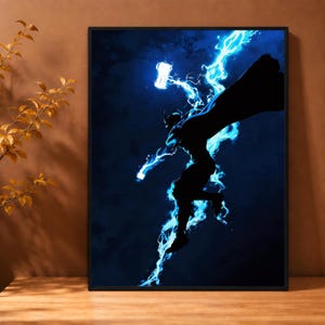 May include: A framed rectangular wall art print featuring a dark silhouette of a figure in a cape, leaping through a deep blue background. The figure is surrounded by bright, glowing electric blue lightning bolts and holds a glowing hammer.