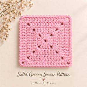 May include: A square crochet motif in light pink yarn featuring a central star-like design with openwork corners. Below the square, the text reads: Solid Granny Square Pattern, a small heart icon, and the text: by Mama & Granny.