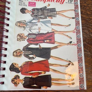 May include: A vintage Simplicity 7751 sewing pattern booklet featuring six illustrations of dresses in various styles and colors, including plaid, solid red, and dark patterns, with text indicating miss size 10 and bust 32 1/2 inches.