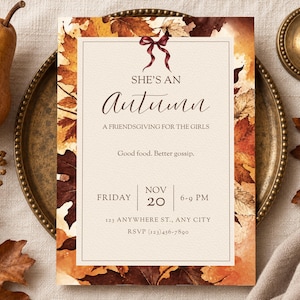 May include: A rectangular invitation card featuring a border of autumn leaves in shades of orange, brown, and yellow. The text reads: SHE'S AN autumn A FRIENDSGIVING FOR THE GIRLS Good food. Better gossip. FRIDAY NOV 20 6-9 PM.
