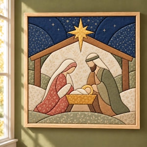 May include: A square fabric wall art piece in a light wood frame depicting a nativity scene. The design features a gold star above a manger with two figures in red and green patterned robes, set against a dark blue starry night sky.