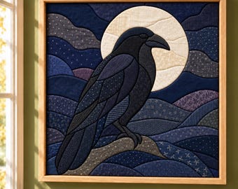 May include: A square fabric wall art piece featuring a dark blue and black raven perched on a branch against a large, cream-colored full moon. The background consists of layered, quilted blue fabric waves with subtle white patterns.