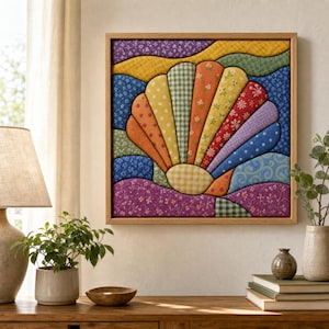 May include: A square wall art piece featuring a fabric-covered seashell design composed of various patterned and colored textile segments in shades of purple, yellow, green, orange, red, and blue, framed in a light-toned wooden border.