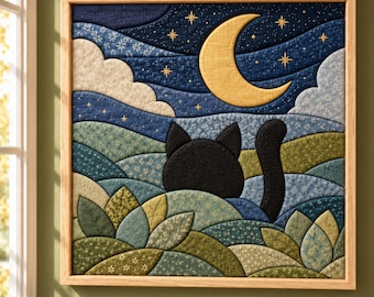 May include: A square fabric wall art piece in a light wood frame featuring a quilted landscape. A black cat silhouette sits in a rolling green and blue floral field under a dark blue night sky with a yellow crescent moon and gold stars.