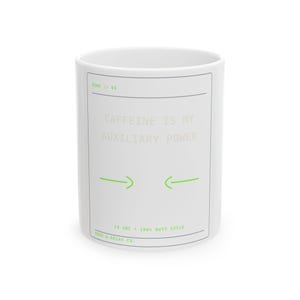 May include: A white ceramic mug featuring a rectangular border in thin grey lines. The text reads CAFFEINE IS MY AUXILIARY POWER in grey, with RUNG // 04 and 24 VDC 100% DUTY CYCLE RUNG & RELAY CO. in lime green. Two lime green arrows point inward.