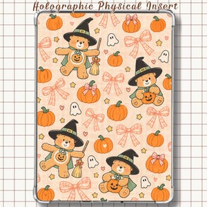 May include: A rectangular tablet case featuring a repeating pattern of light orange pumpkins, pink plaid bows, small white ghosts, and yellow stars. The design includes illustrations of light brown bears wearing black witch hats and green capes.