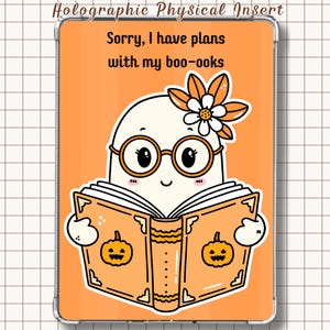 May include: A rectangular holographic physical insert featuring an orange background and a cartoon ghost wearing round glasses and a flower, reading an orange book with pumpkin illustrations. The text reads: Sorry, I have plans with my boo-ooks.