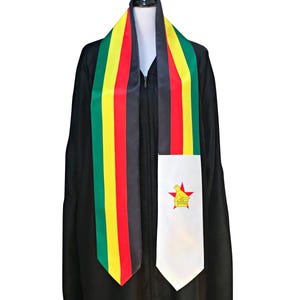 May include: A graduation stole featuring vertical stripes of green, yellow, red, and black. The right side ends in a white panel displaying a yellow bird emblem centred on a red star. The stole is draped over a black graduation gown on a mannequin.