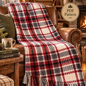 May include: A woven throw blanket featuring a plaid pattern in red, white, black, and gray with fringe trim along the bottom edge. A circular badge in the upper right corner displays the text PDF Pattern with a small tree icon above it.