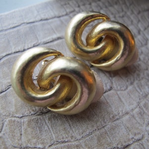Iconic Florentine Gold Tone Plate Finish Double Interlocking Designer Les Bernard Gold Clip On Earrings. Classic Timeless Costume Signed
