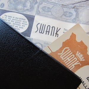 Billetera de cuero negra de la vieja escuela para hombre, Swank is the Maker, stock antiguo sin usar, color piel de cabra negra, vintage, anuncio original