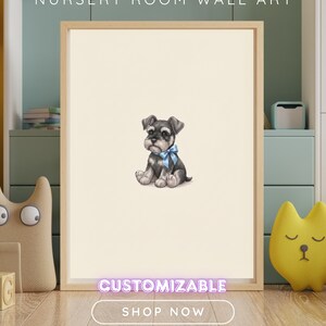 May include: A rectangular wooden frame containing a cream-colored print of a small, seated black and gray puppy wearing a light blue bow around its neck. The text NURSERY ROOM WALL ART appears at the top, with CUSTOMIZABLE and SHOP NOW below.