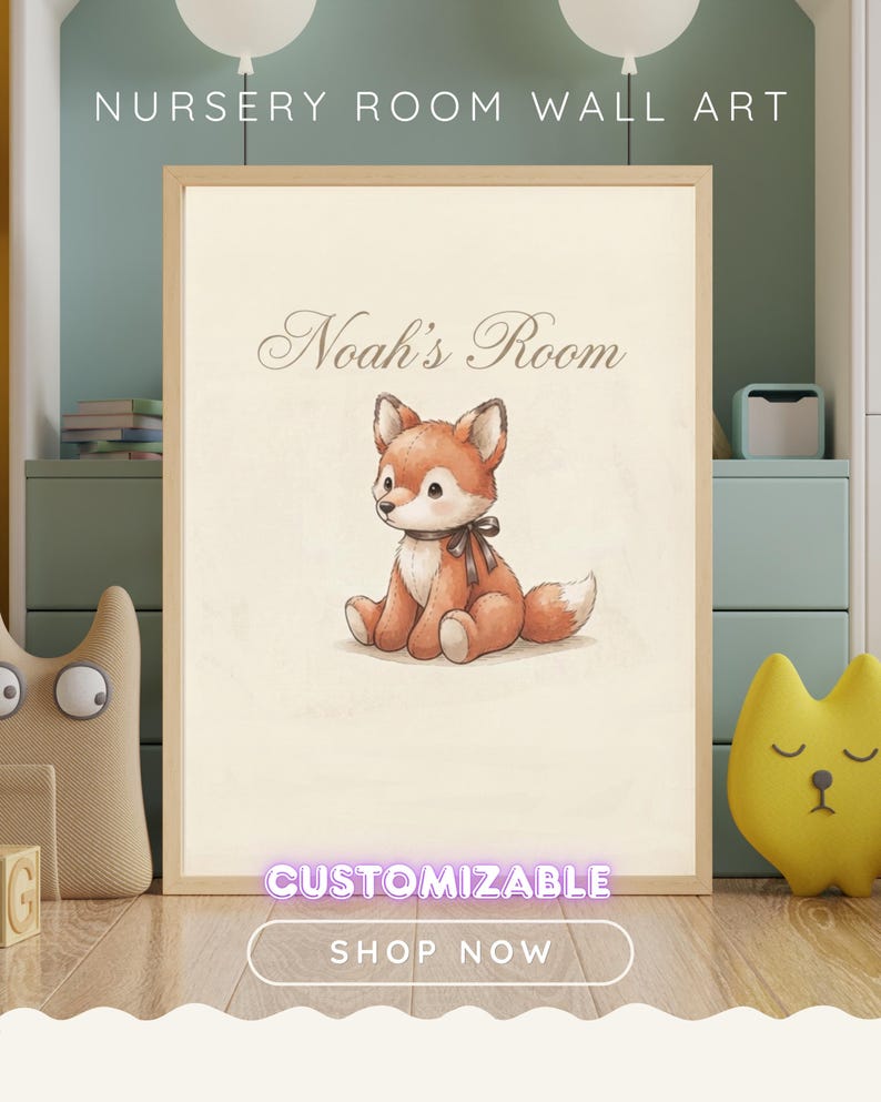 May include: A framed wall art print featuring a watercolour-style illustration of a seated orange and white fox with a dark brown ribbon around its neck. The text Noah's Room is printed in a script font above the fox on a cream-coloured background.