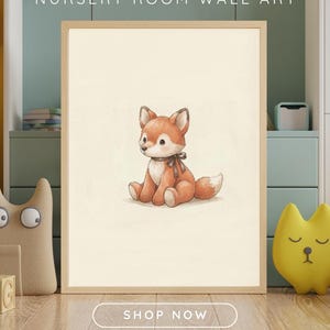 Vintage style digital art print of a cute plush fox toy with a ribbon, hanging in a neutral baby nursery frame.