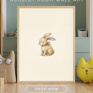 Nursery wall art mockup showing a vintage-style digital print of a cute bunny plush toy with a red ribbon in a wooden frame, set against a cozy green and beige child's room background with toys.
