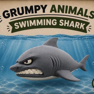 May include: A gray shark figurine with a grumpy facial expression, white teeth, and a light underbelly. The image features the text GRUMPY ANIMALS and SWIMMING SHARK on a banner, with an AMS logo in the corner, set against an underwater background.