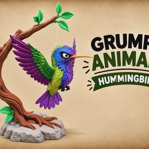 May include: A colorful hummingbird figurine with purple, green, and blue feathers, a long orange beak, and a grumpy expression, suspended from a brown tree branch on a gray rock base. The text reads GRUMPY ANIMALS HUMMINGBIRD.