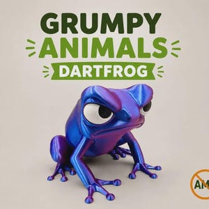 May include: A 3D printed dart frog figurine with a metallic blue and purple finish, featuring large white eyes with black pupils. The text GRUMPY ANIMALS DARTFROG is displayed above the frog, and an AMS symbol with a line through it is in the corner.