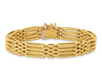 May include: A polished yellow gold bracelet featuring a multi-row link design with elongated, rounded rectangular segments connected by smaller circular loops. The piece includes a secure box clasp closure with a safety latch mechanism.