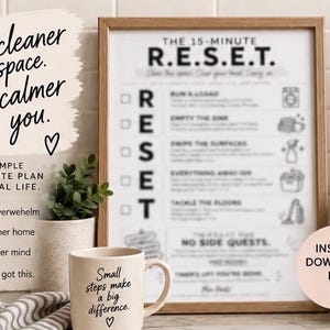 May include: A framed print titled The 15-Minute R.E.S.E.T. featuring a cleaning checklist with icons, next to a beige mug with the text Small steps make a big difference. The print includes text A cleaner space. A calmer you. and A simple 15-minute plan for real life.