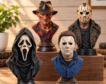 May include: A collection of four horror movie character busts featuring a white-masked figure in a black hooded robe, a scarred figure in a brown fedora, a hockey-masked figure in a tattered jacket, and a white-masked figure in a blue collared shirt.
