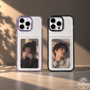 May include: Two rectangular smartphone cases with clear backs and colored frames. The left case has a purple frame and features a portrait of a person with dark hair. The right case has a black frame and features a portrait of a person with headphones.