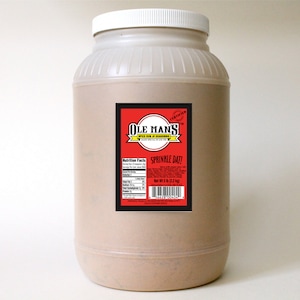 May include: A large plastic jar filled with brown seasoning. The label is red and black and says "Ole Man's" and "Sprinkle Dat!" with nutrition facts listed.