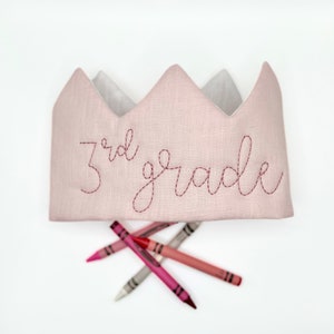 pink linen crown headband with 3rd grade embroidered on the front in rose thread