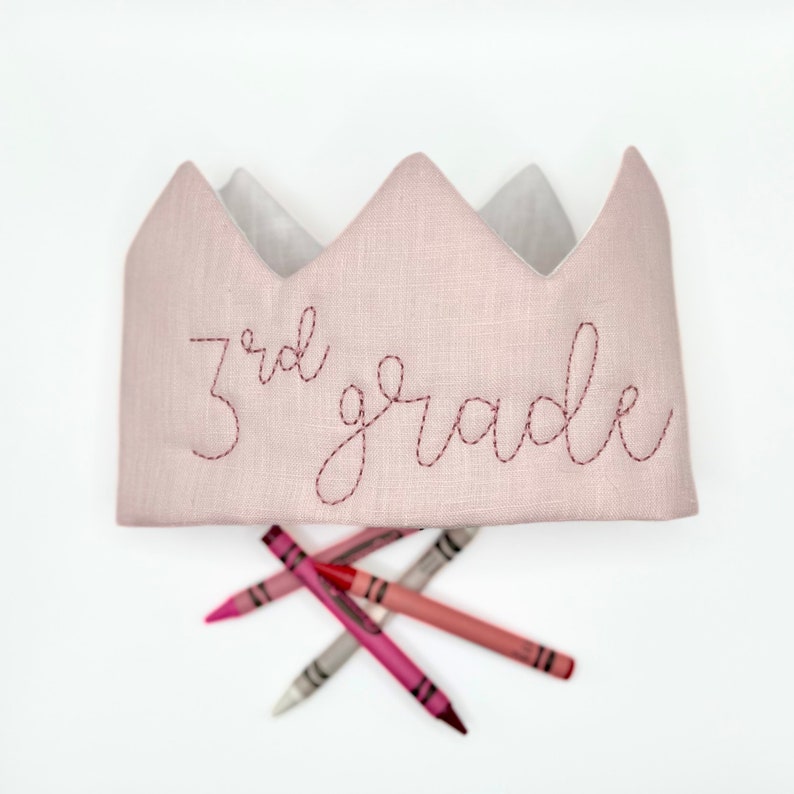 pink linen crown headband with 3rd grade embroidered on the front in rose thread