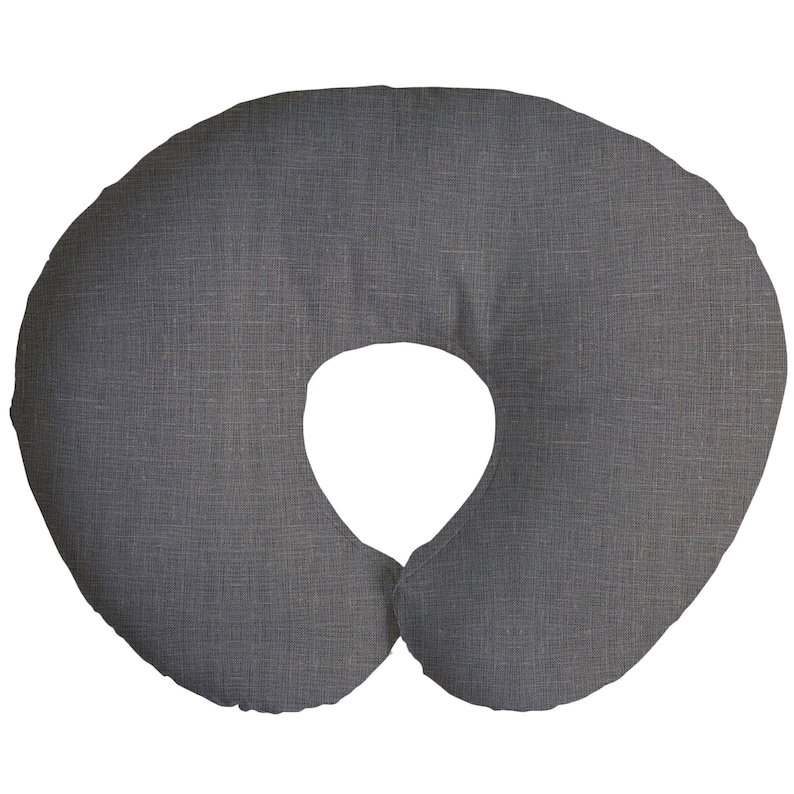 May include: A gray, U-shaped nursing pillow with a textured fabric cover.