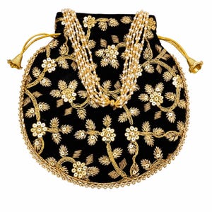 May include: A black velvet drawstring pouch featuring intricate gold thread embroidery and sequin floral patterns. The bag is adorned with a multi-strand pearl handle and a gold beaded border, finished with two gold-toned bell-shaped drawstring ends.